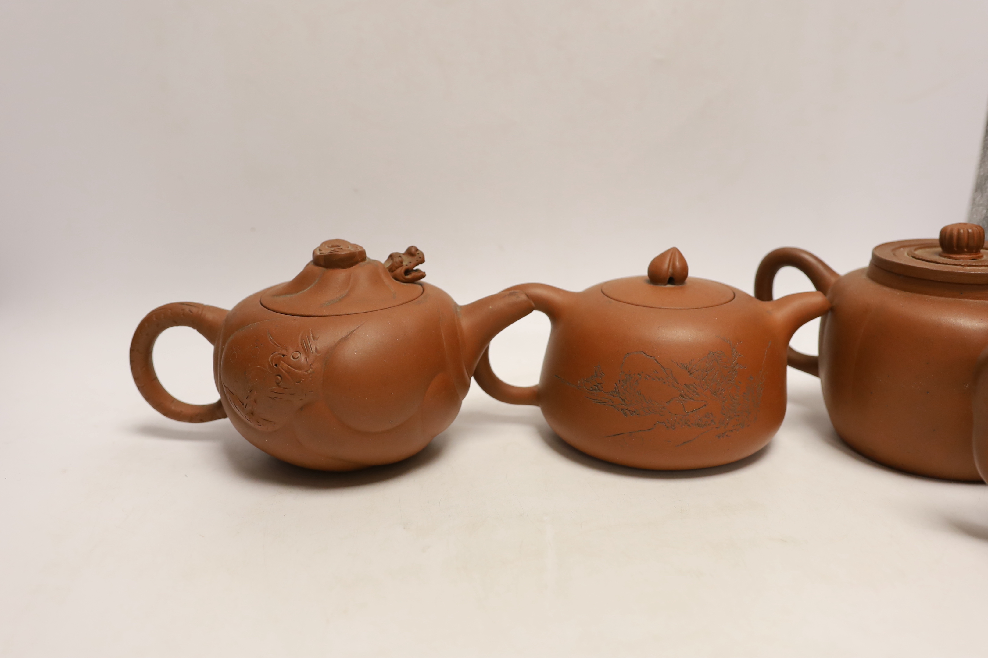 Six Chinese Yixing terracotta teapots, largest 11cm